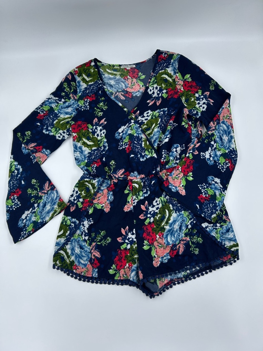 Charlotte Russe Boho Bold Navy Floral Long-Sleeve Wrap Romper With Pompom Trim M